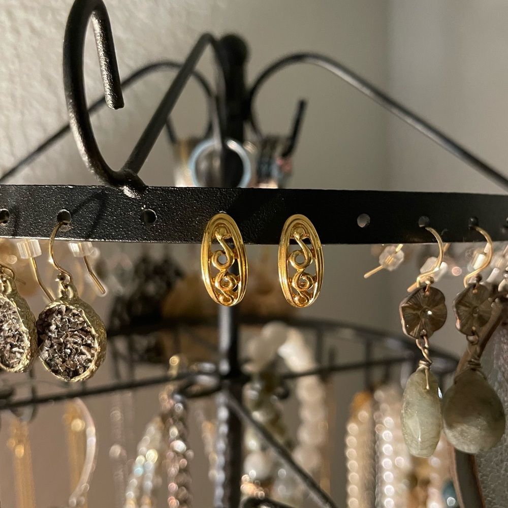 Gold tone swirl design earrings